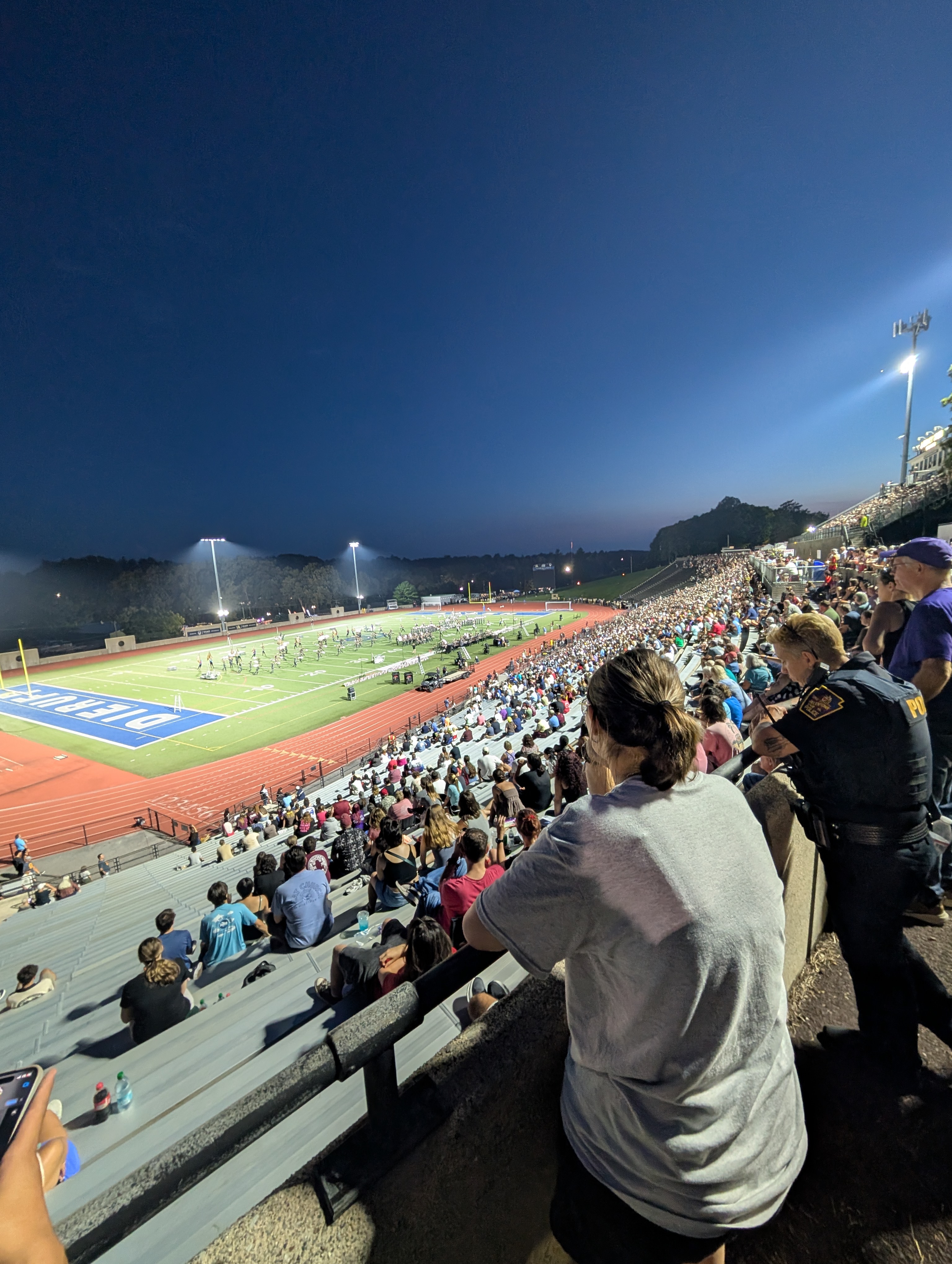 J. Birney Crum Stadium from the top of the stands with a drum corps on the field.