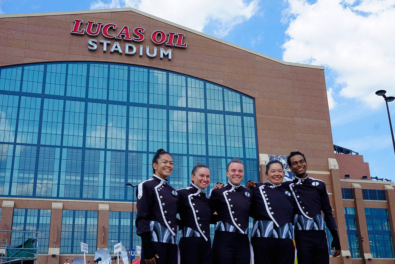 A drum corps cymbal line posting after their performance.