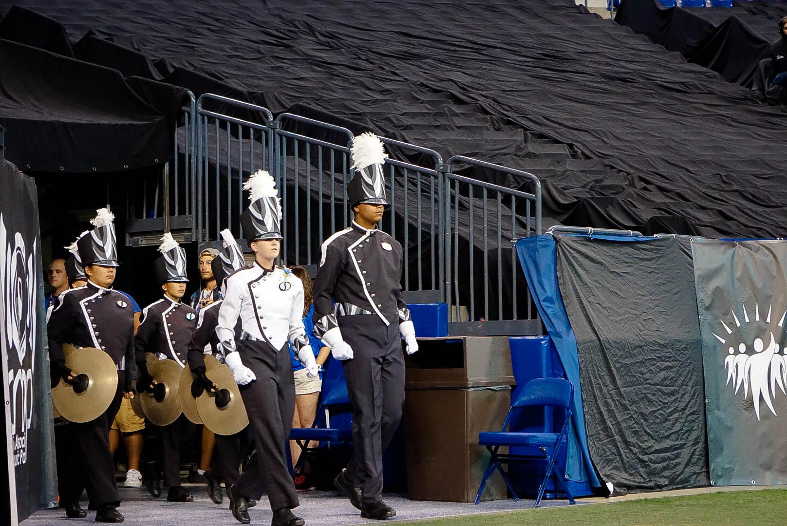 Drum corps members marching on to the field prior to their show.
